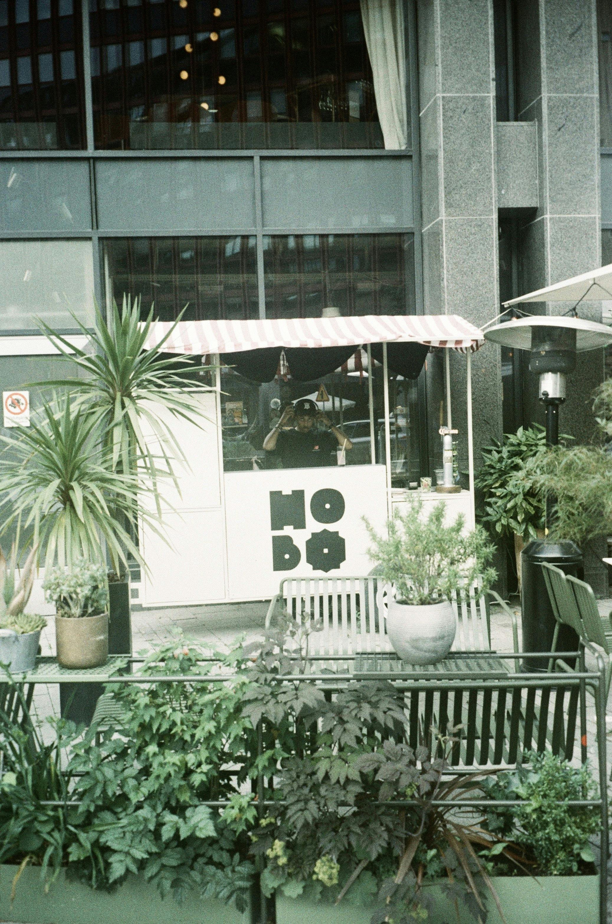 Outdoor patio at Hobo Hotel with kiosk, ideal for casual gatherings and networking events.