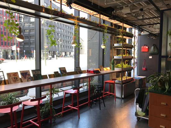 Modern lobby with large windows, ideal for networking events and casual meetings.