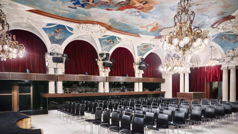 Elegant conference center with ornate ceilings, ideal for formal presentations and gala events.