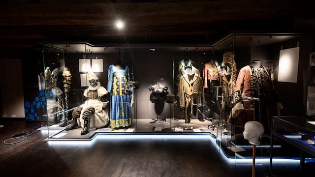 Historical costumes display at The Performing Arts Museum for themed events.