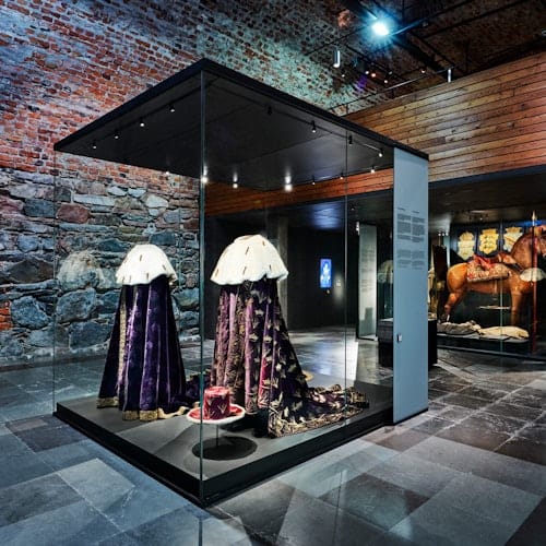 Historical garments display at The Performing Arts Museum for elegant themed events.