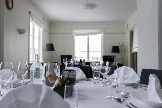 Conference room with elegant tableware for intimate meetings at Stora Brännbo Hotel.