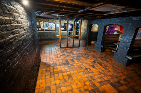 Rustic event space with exposed brick walls at Bacchus Late Bar for gatherings and meetings. - Banner