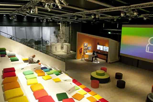 Modern Ericsson Studio event space with colorful seating for workshops and seminars.