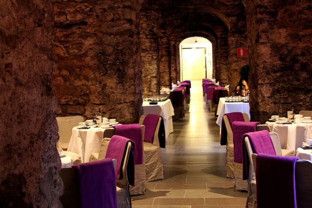 Stensalen dining space with rustic stone walls, ideal for private events and gatherings.