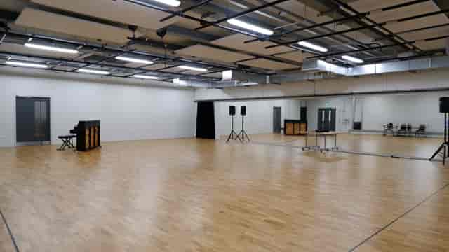 Professional Rehearsal Studio with wooden flooring, ideal for workshops and performances.