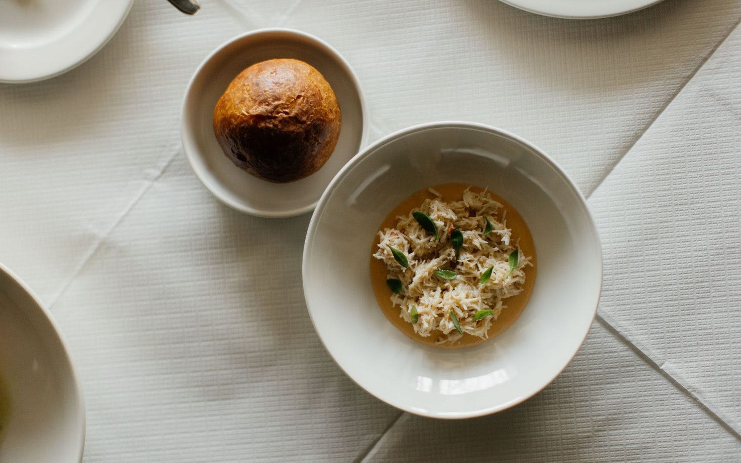 Lasdun Restaurant meal: herb rice bowl and roll, perfect for events and catering.