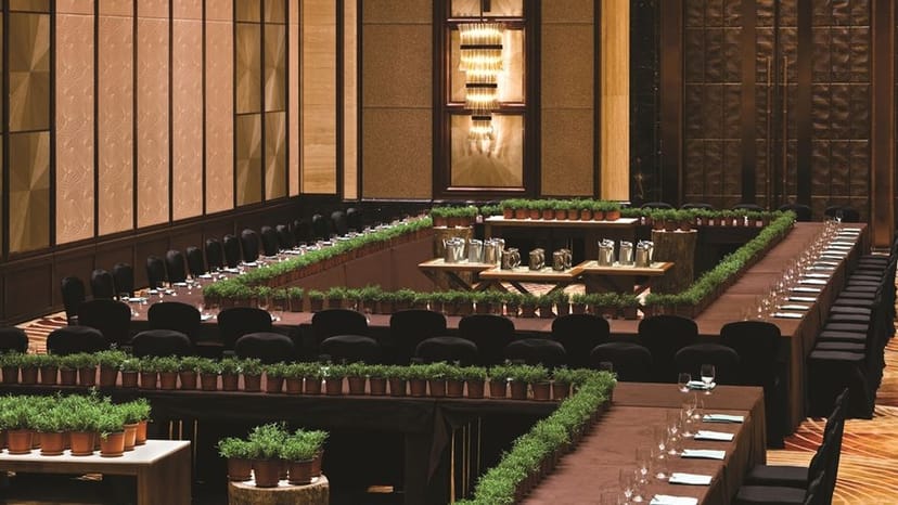 Corporate conference setup with U-shaped table and greenery at Kerry Hotel Pudong, Shanghai.