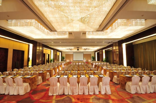 Conference room at The Eton Hotel Shanghai with elegant round tables for corporate events.