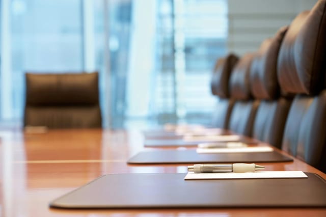 Modern conference room at The Eton Hotel Shanghai with leather chairs for meetings.