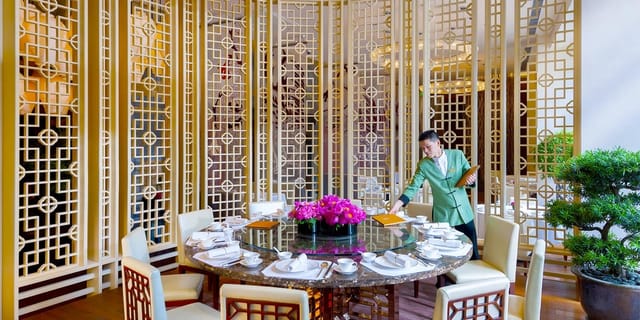 Elegant dining table in The Boardroom, Capella Shanghai for corporate events and gatherings.