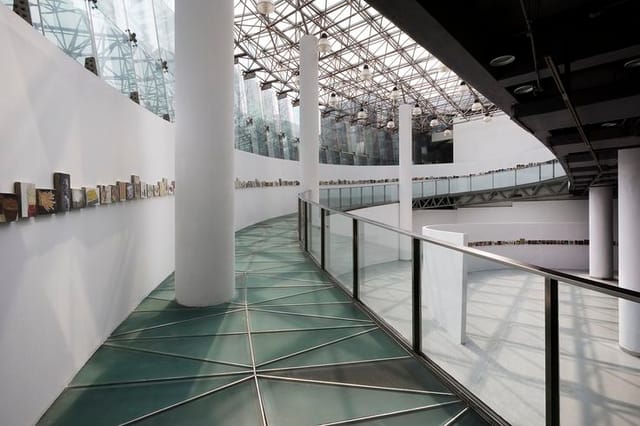 Modern MoCA Pavilion with glass ceiling, ideal for events and exhibitions.