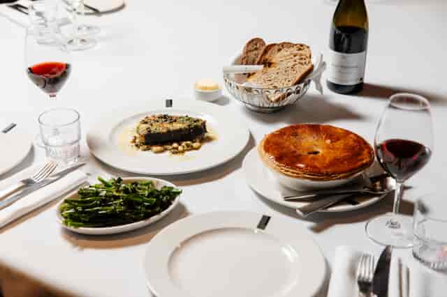 Private dining room at Lasdun Restaurant, elegant table set for corporate dinner event.