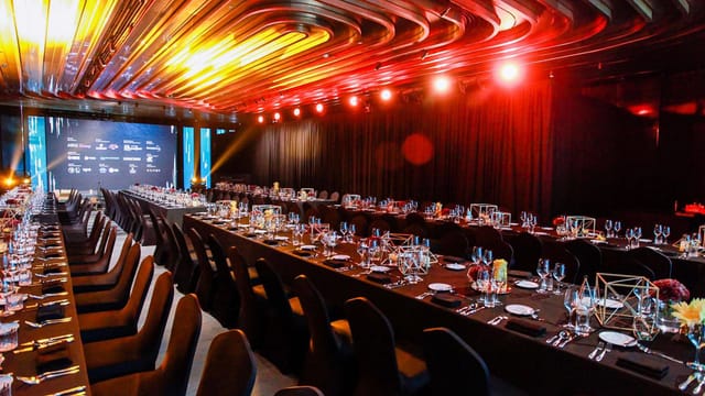 Elegant conference center in Fosun Foundation Shanghai set for formal dinner event.
