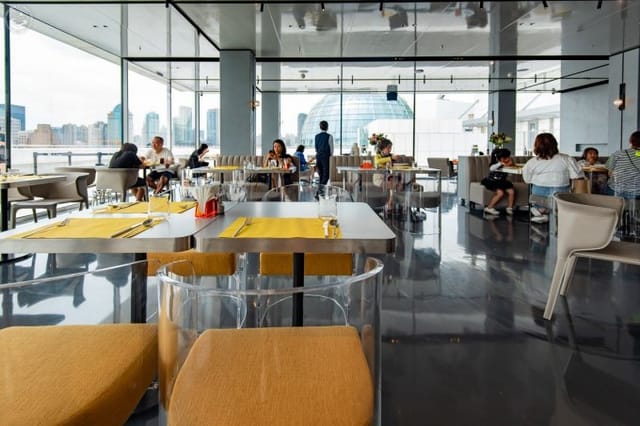ARTsMALL Café in Shanghai: modern dining space with natural light for corporate events.