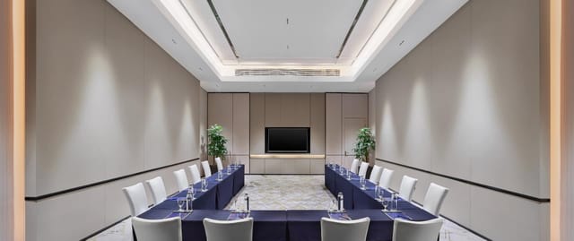Meeting room at DoubleTree by Hilton Shanghai, U-shaped seating for corporate events.