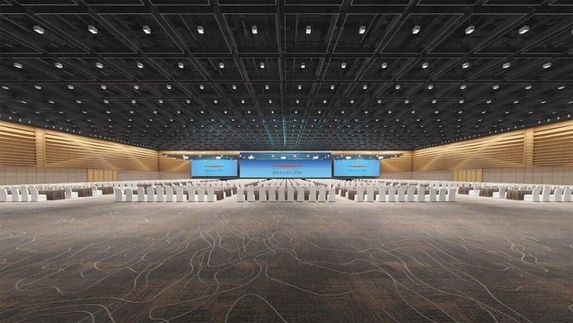 Spacious conference room with tables and chairs for events at National Convention Center.