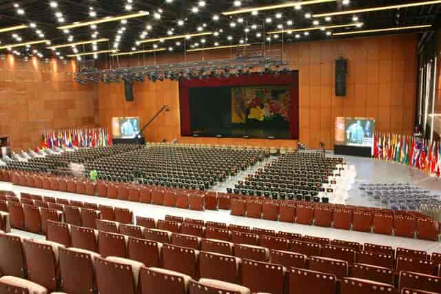 Spacious conference room with tiered seating for global events at National Convention Center.