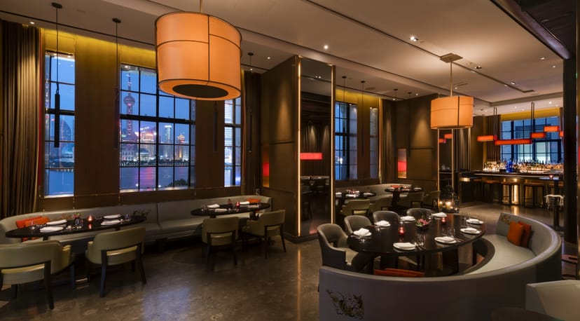 Cage at Hakkasan Shanghai: elegant dining space with city skyline for upscale events.