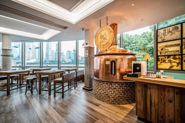 Stylish Paulaner Wirtshaus Shanghai with copper brewing kettle, perfect for networking events.