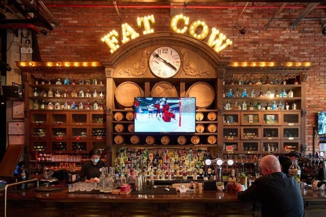 Vibrant bar at Fat Cow restaurant, perfect for casual networking and social gatherings.