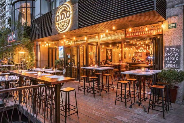 Vibrant outdoor dining space in D.O.C Shanghai, ideal for casual events and networking.