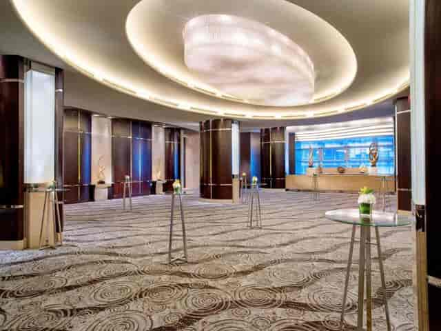 Open dining area with elegant lighting, perfect for corporate events and networking.