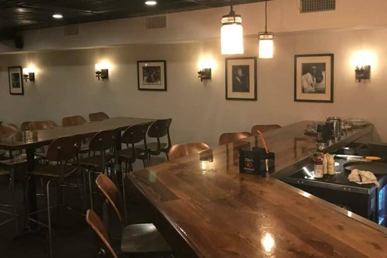 Main Floor Long Oak Bar in Shanghai Jazz, stylish decor for events and gatherings.