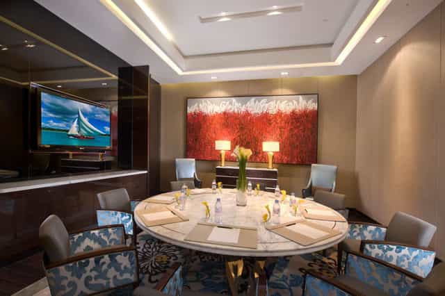 Sophisticated meeting room with round table at Kempinski The One Suites Hotel Shanghai.