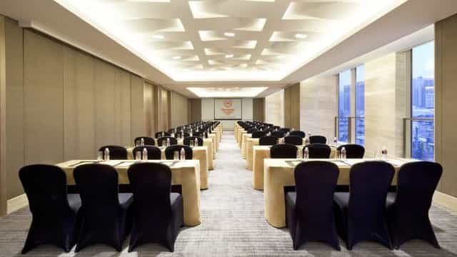 Conference room with elegant tables and chairs for corporate events in Sheraton Shanghai.