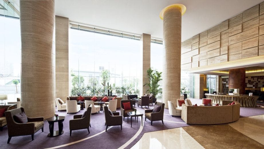 Modern conference room with natural light at Sheraton Shanghai for meetings and events.