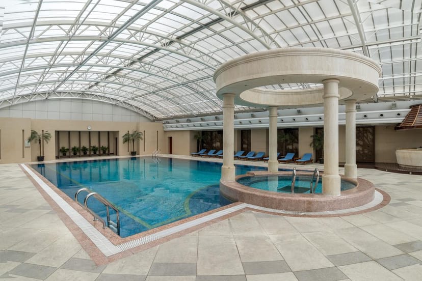 Spacious indoor pool at New World Hotels, perfect for events and wellness retreats.