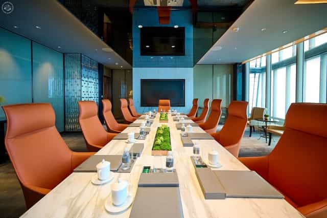 Modern conference room in J Hotel Shanghai with sleek table, ideal for meetings and presentations.