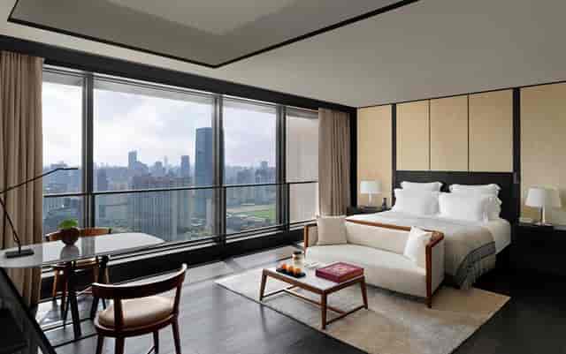 Modern event space at Bulgari Hotel Shanghai with city views, ideal for VIP retreats.
