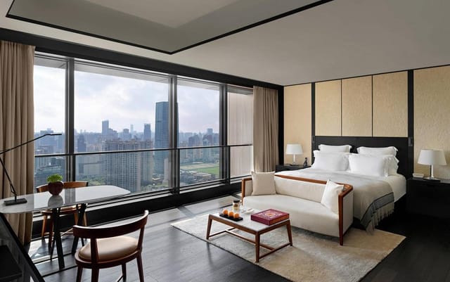 Modern event space at Bulgari Hotel Shanghai with city views, ideal for VIP retreats.
