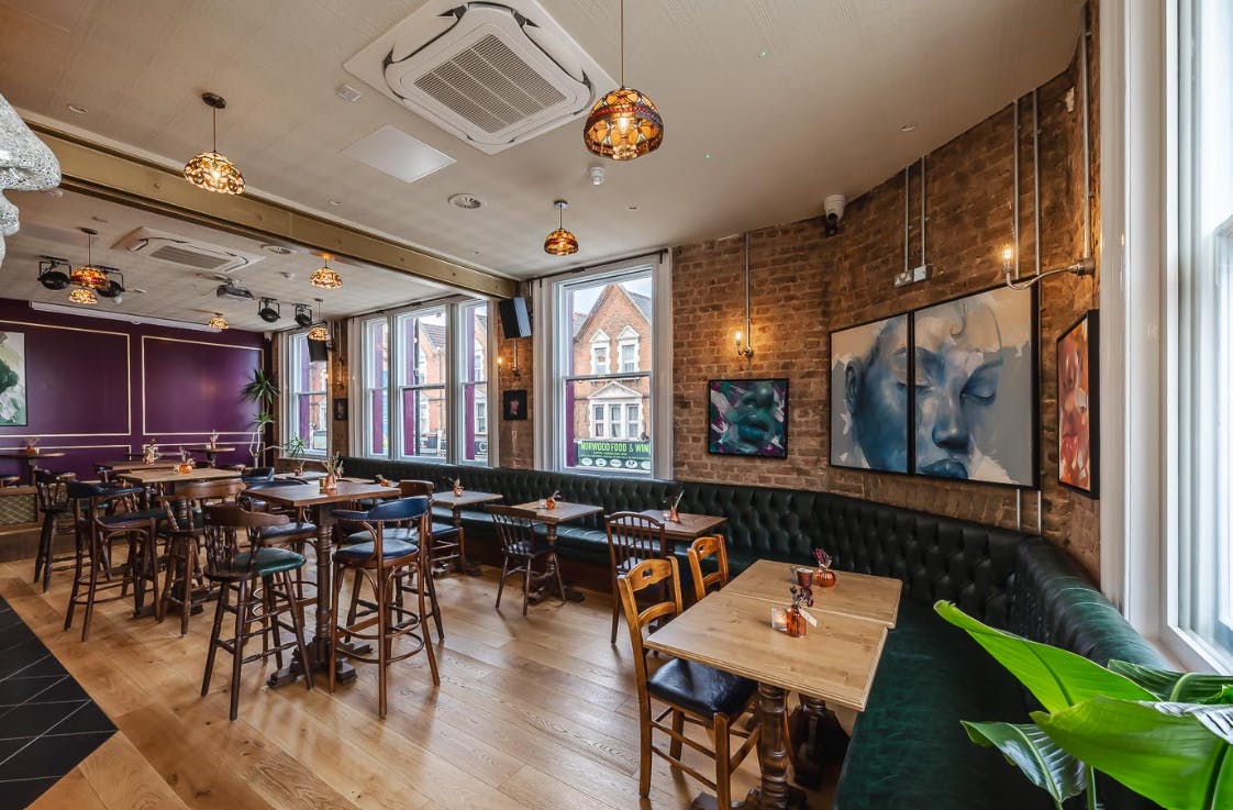 Cozy Co-Working space in Queen of The South Pub, ideal for networking events and meetings.