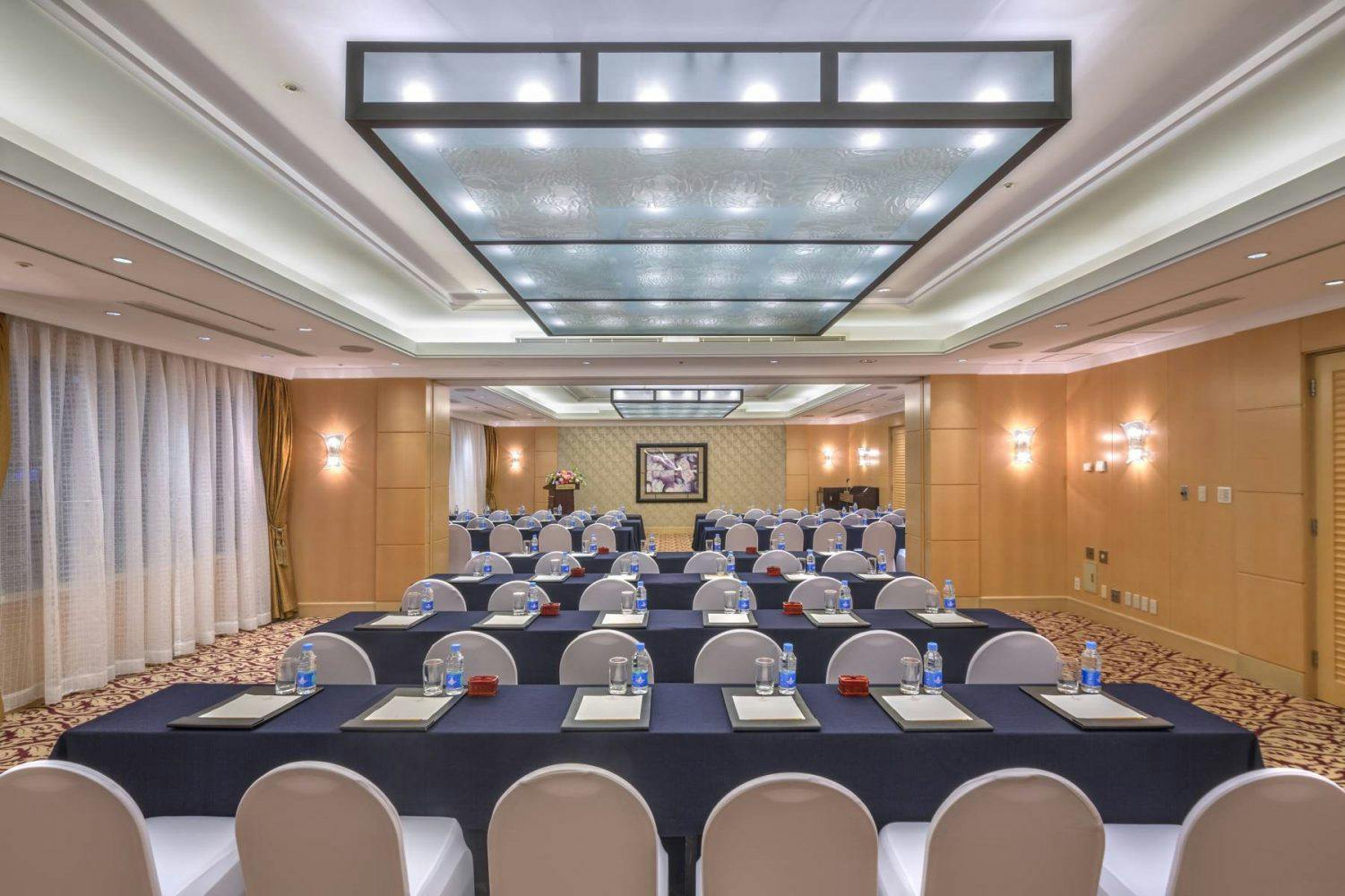 Meeting room setup at Okura Garden Hotel Shanghai, elegant decor for professional events.