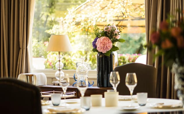 Elegant table setting with floral centerpiece for intimate gatherings at Da Vittorio restaurant.