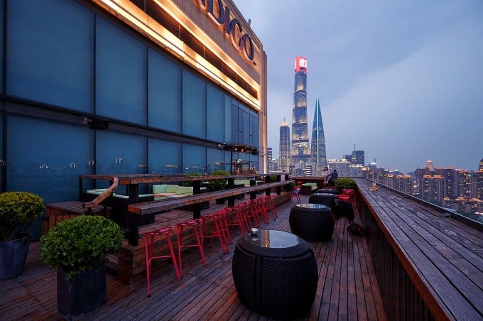 Rooftop lounge at Hotel Indigo Shanghai, modern venue with panoramic city views for events.