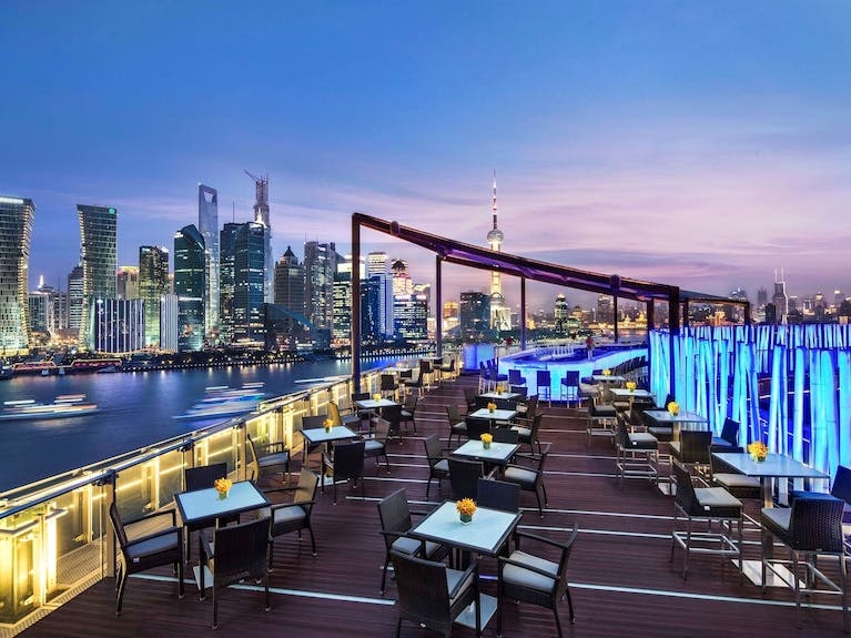 Elegant rooftop ballroom with city skyline, perfect for upscale events in Shanghai.