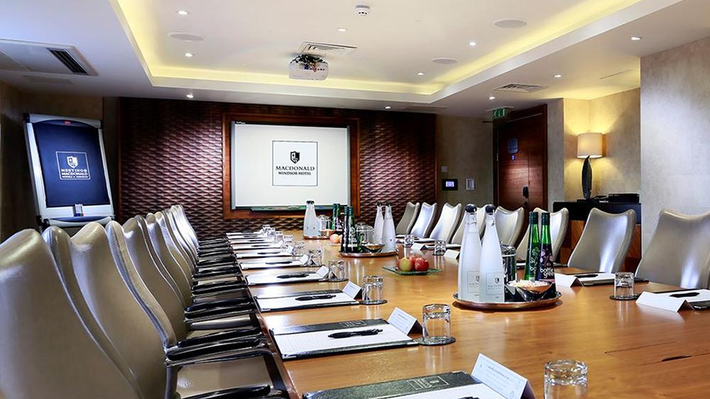 Kensington Boardroom at Macdonald Windsor Hotel, ideal for professional meetings and conferences. - Banner