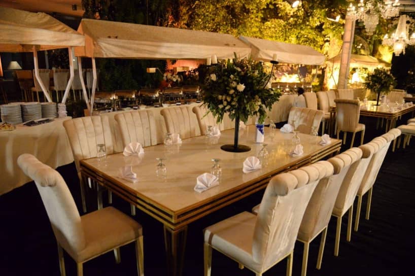 Elegant dining area with floral centerpiece, perfect for weddings and corporate events.