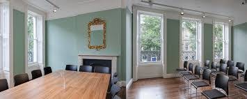 Boardroom at Charles Dickens Museum with large wooden table for meetings and events.