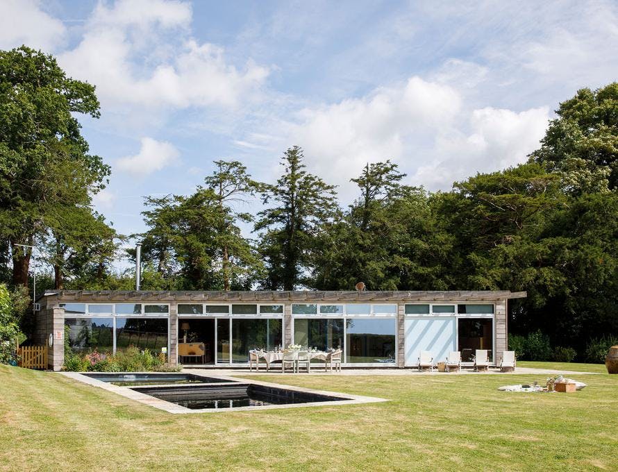 Modern Orangery venue with large windows, perfect for outdoor events and meetings.