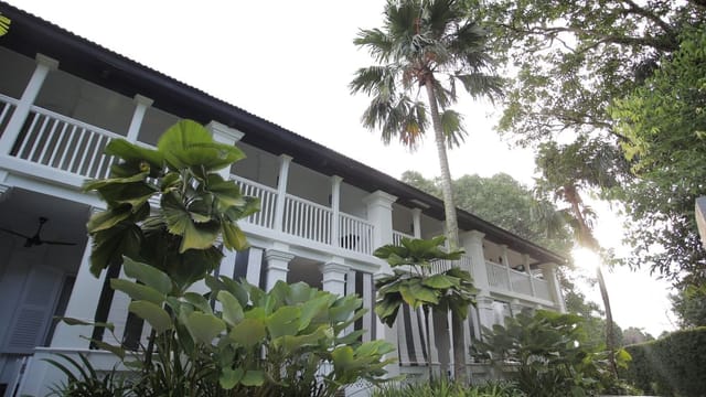 Courtyard Suites at Amara Sanctuary Resort, ideal for events with lush greenery and balconies.