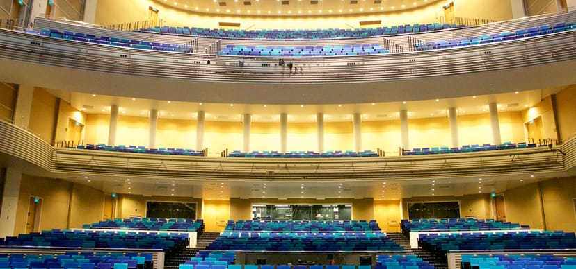 Modern Sands Theatre auditorium with tiered seating for conferences and performances.