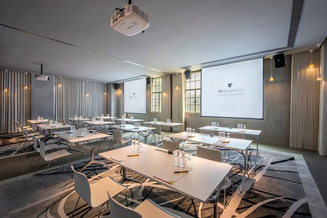 Modern Britannia Room at JW Marriott Singapore, ideal for professional events and presentations.