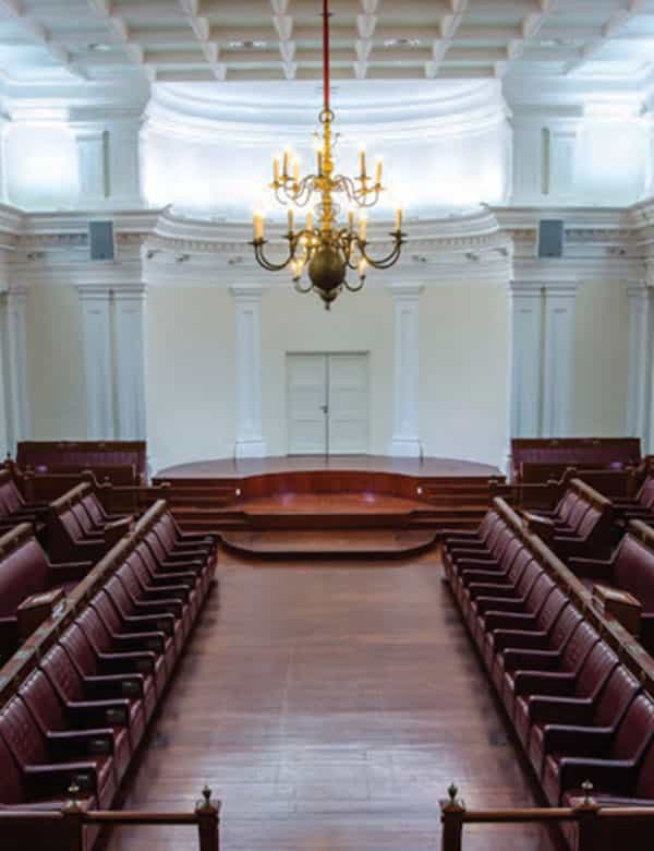 Elegant meeting room with raised stage, ideal for conferences and formal events.