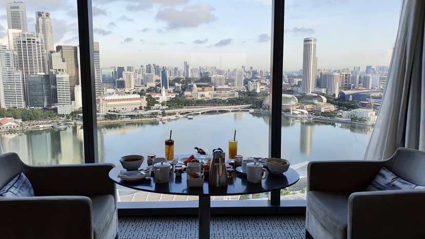 Elegant restaurant table with skyline view, ideal for morning networking events.