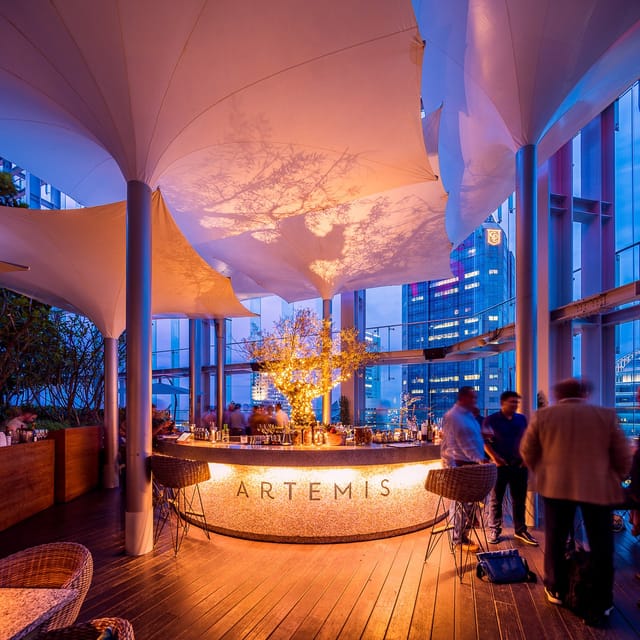 CBD Set Lunch at Artemis Grill & Sky Bar with city skyline backdrop, perfect for upscale events.